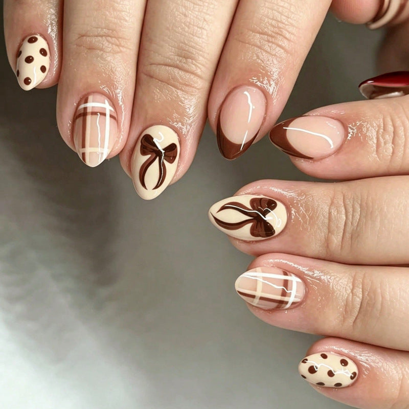 Artificial nail set with elegant bow and caramel designs Bowlift