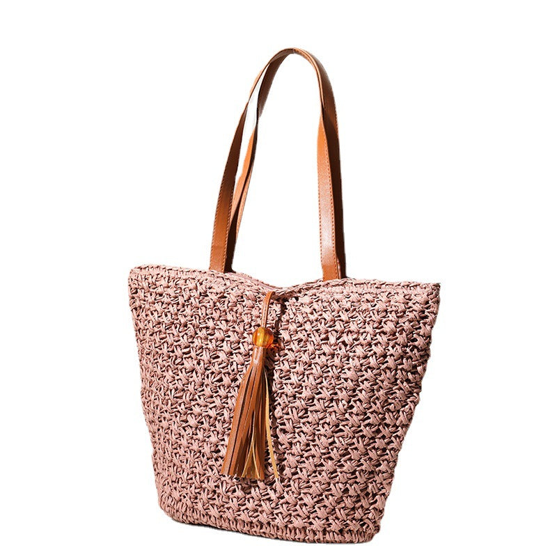 Handcrafted basket bag with fashionable tassel detail Bowlift
