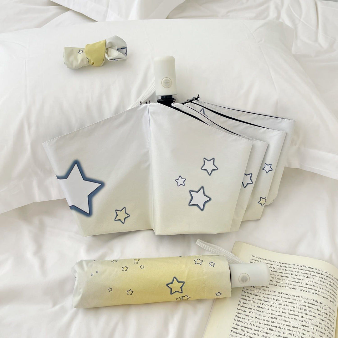 Women's compact folding umbrella with star pattern Bowlift