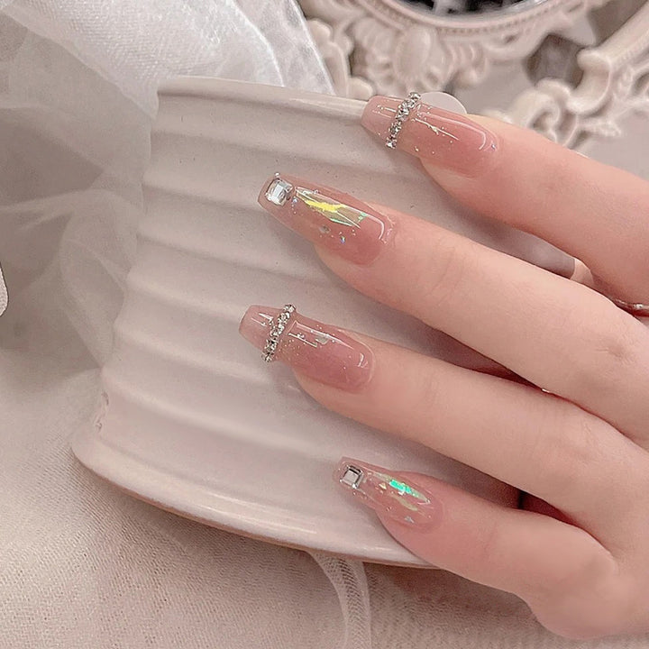 Acrylic nail set with glamorous rhinestone and glitter elements Bowlift