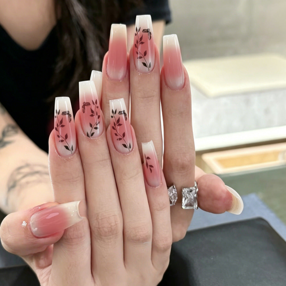 Artificial nails with elegant ombre design and floral accents Bowlift