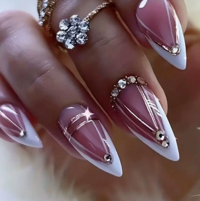 Acrylic nail set with elegant stiletto shape and luxurious embellishments Bowlift