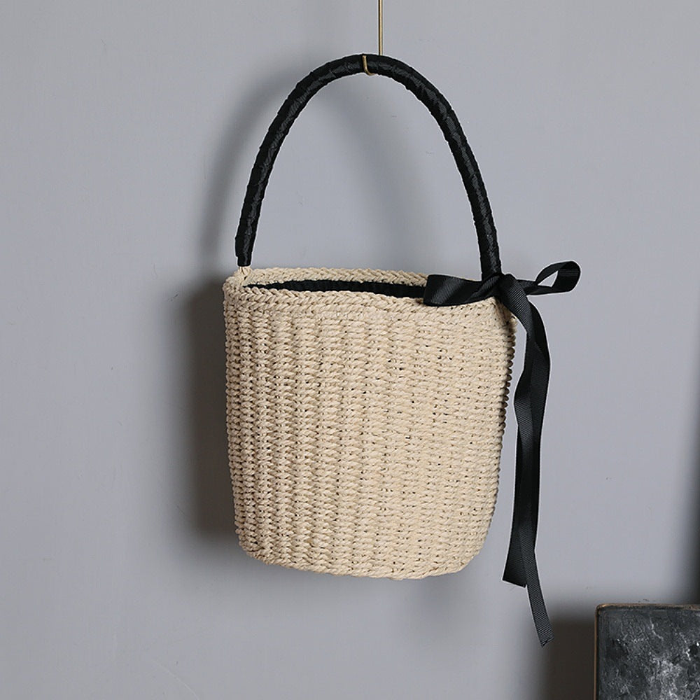Handwoven basket bag with decorative fabric ribbon Bowlift