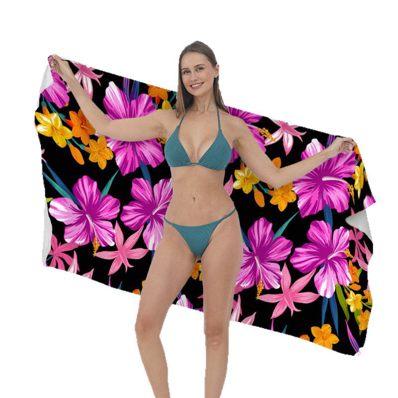 Beach towel with vibrant tropical plant motif Bowlift