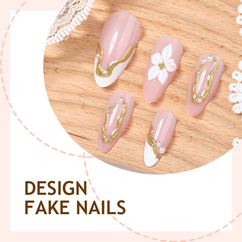 Artificial nail set with elegant gold accents and floral decorations Bowlift