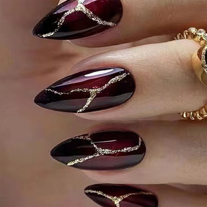Elegant artificial nails with golden accents Bowlift