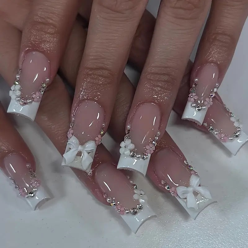 Artificial nails with elegant 3D bows and glitter accents Bowlift