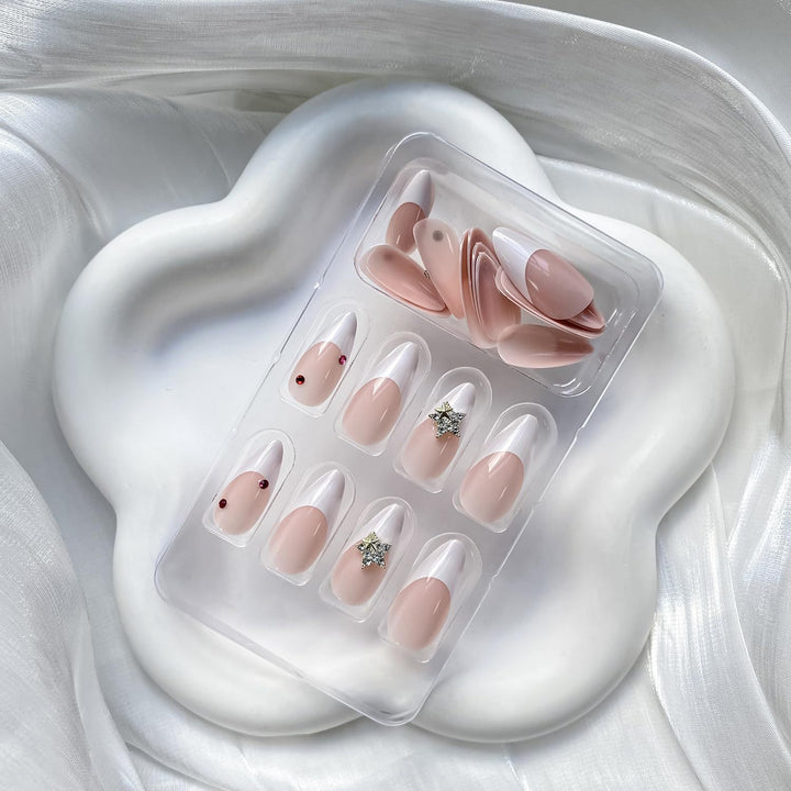 Artificial nail set with elegant French tips and sparkling accents Bowlift