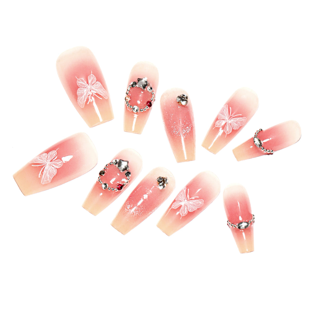 Artificial nail extensions with floral design and sparkling accents Bowlift