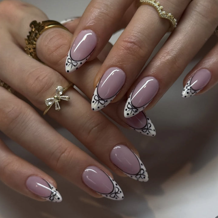 Artistic Stiletto Nails with Elegant Floral Design Bowlift