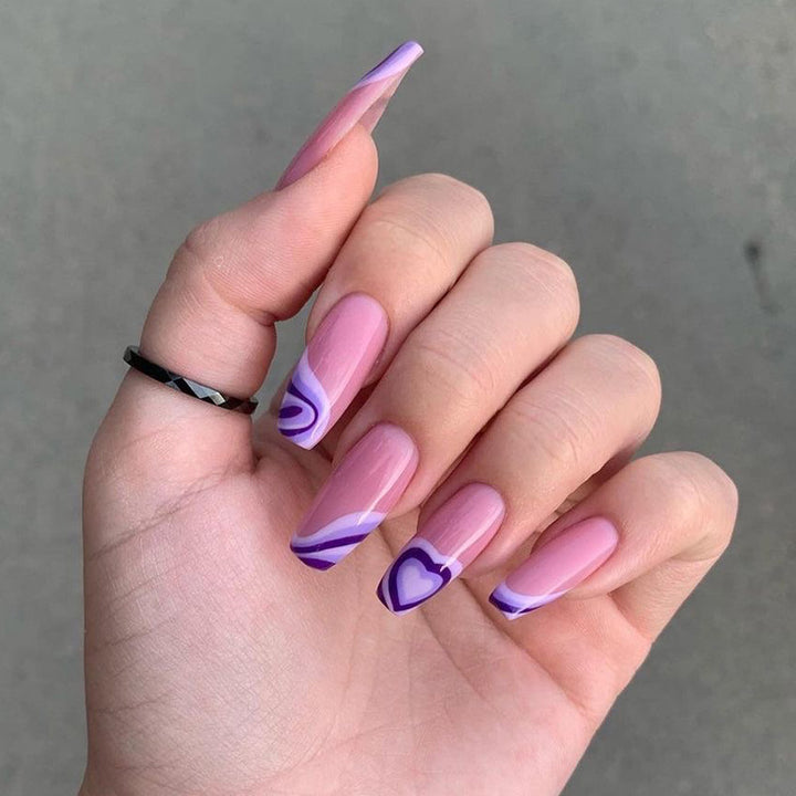 Artistic acrylic nails with creative heart and wave patterns Bowlift