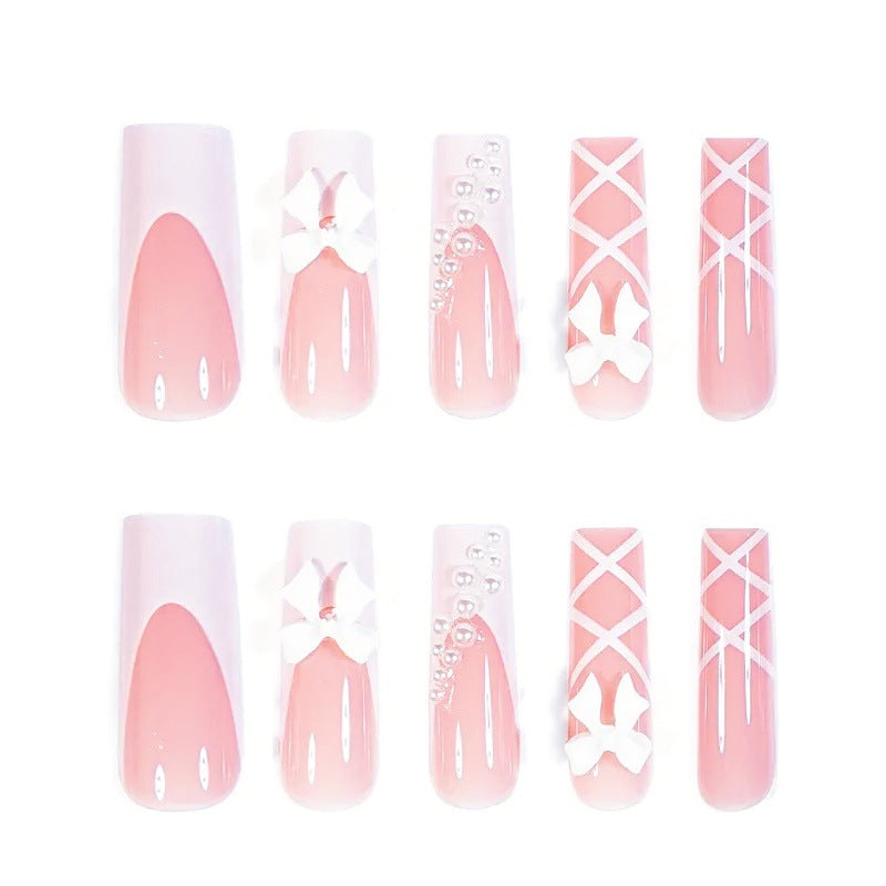 Artificial nail set with elegant 3D bows and pearl embellishments Bowlift