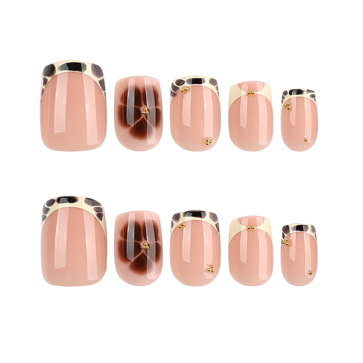 Artful nail extensions with an elegant giraffe pattern and golden accents Bowlift
