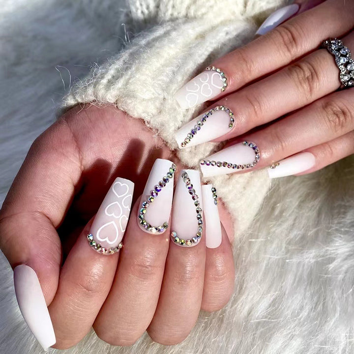 Artful Nail Extensions with Heart Design and Glitter Accents Bowlift