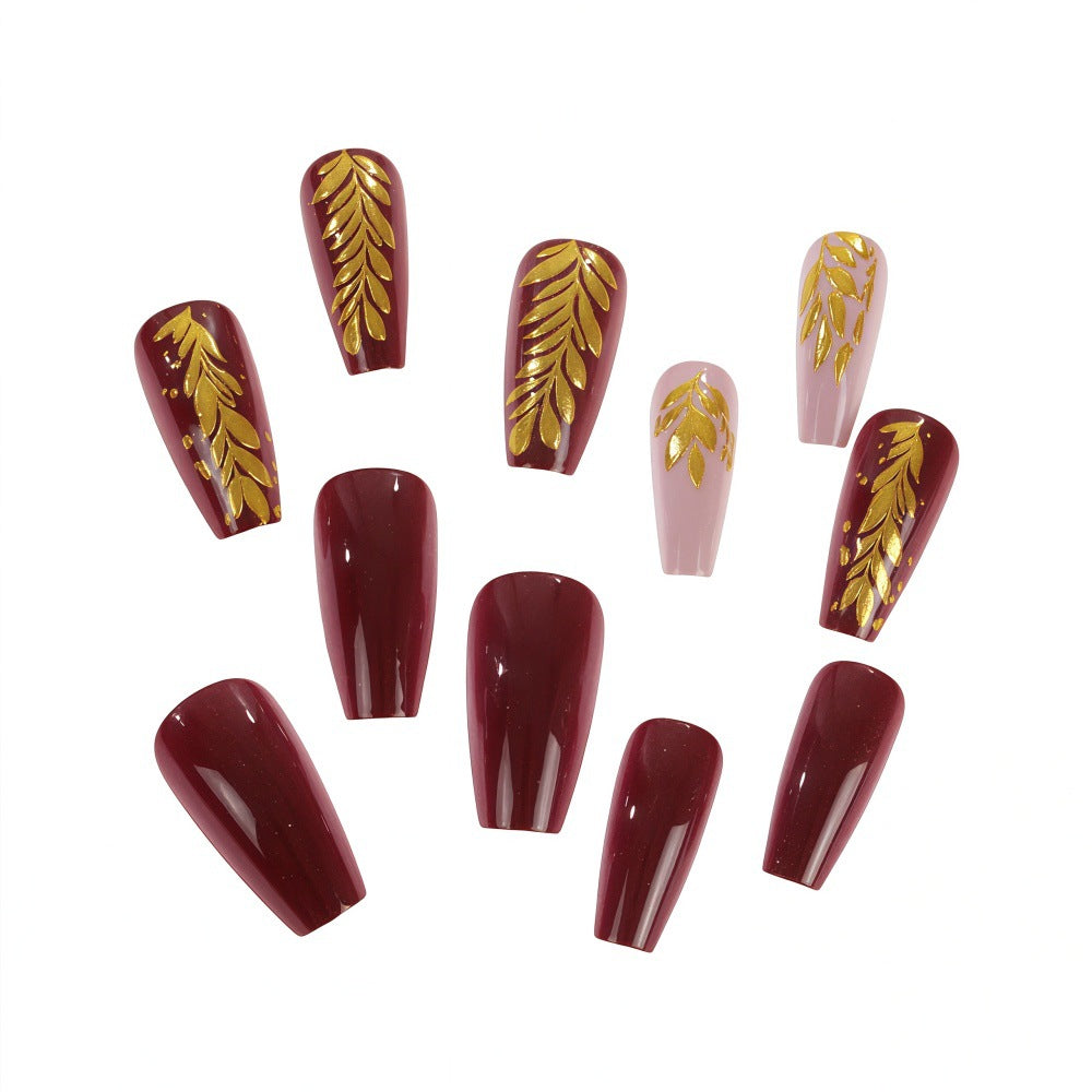 Elegant artificial nails with gold decoration Bowlift