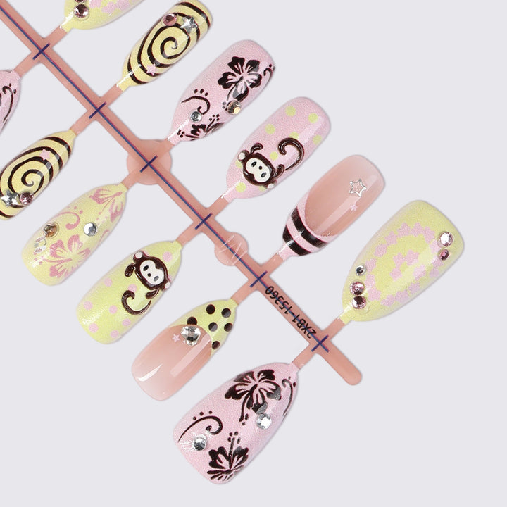 Creative nail art set with playful monkey designs and glitter details Bowlift