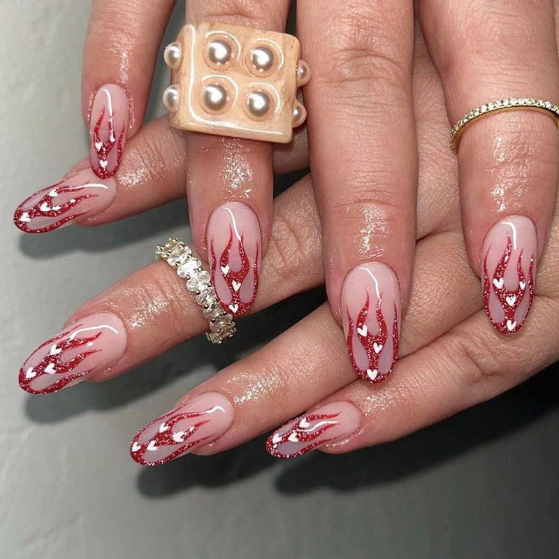 Artificial nail art with romantic heart and flame design Bowlift