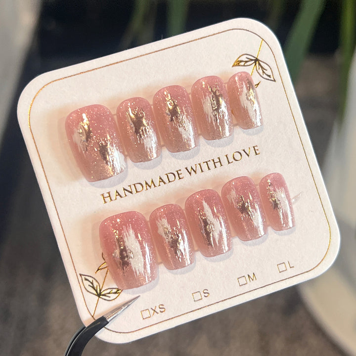 Artificial nail extensions with elegant gold design Bowlift