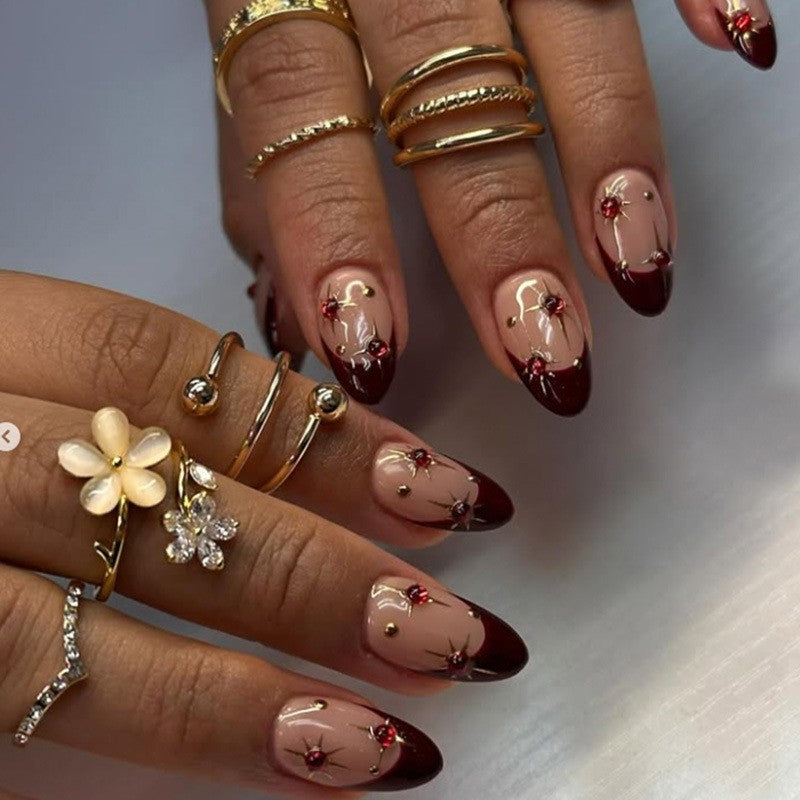 Elegant Pointed Press-On Nail Set with Decorative Accents Bowlift