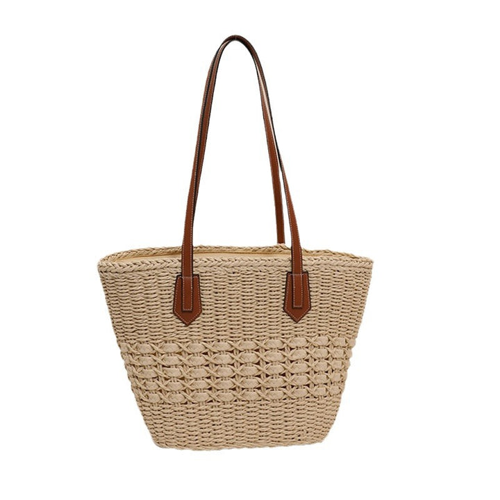 Handcrafted rattan basket bag with elegant leather accents Bowlift