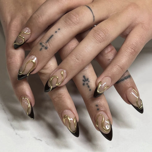 Artful stiletto nails with elegant gold design Bowlift