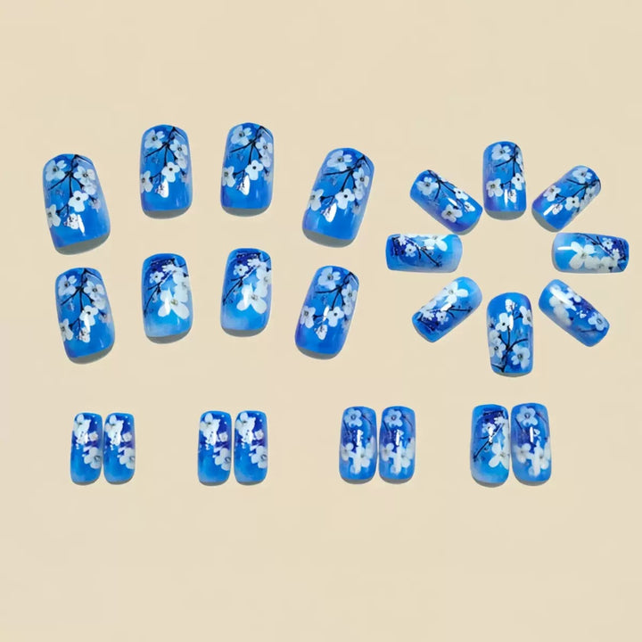 Artificial nail set with floral designs and glitter accents Bowlift
