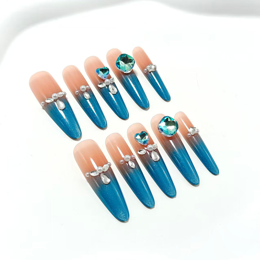 Artificial nails with glitter and rhinestone embellishments Bowlift