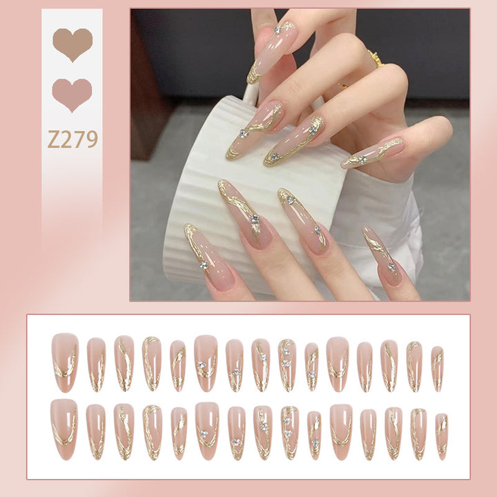 Artificial nail set with elegant gold design and sparkling applications Bowlift