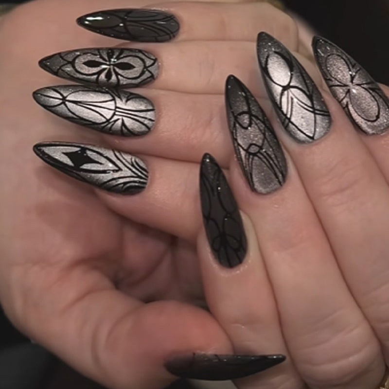 Acrylic nail set with creepy spider design and glitter accents Bowlift