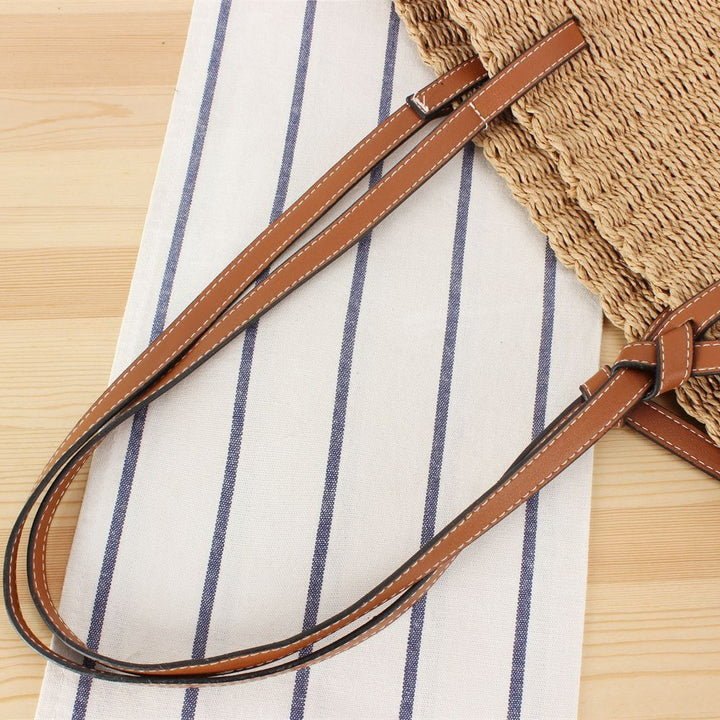 Beach bag made of handwoven natural material with sturdy leather straps Bowlift