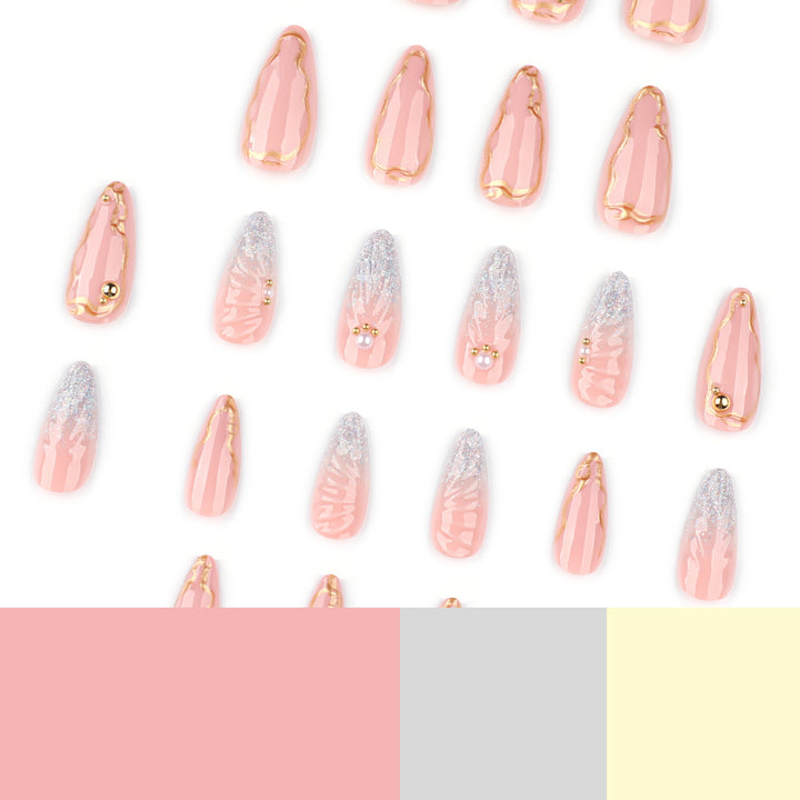 Artful stiletto nails with elegant gold embellishment design Bowlift