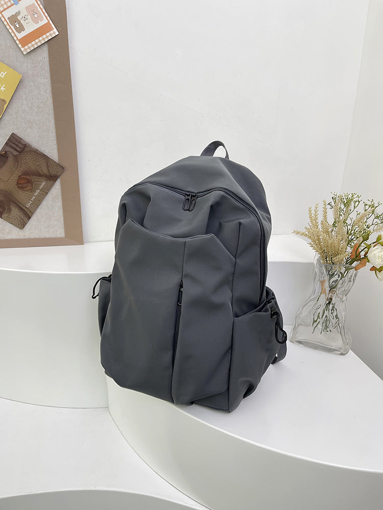 Backpack with Versatile Compartments and Charming Pendant Bowlift