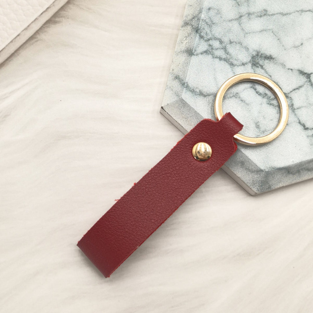 Unisex keychain made of high-quality synthetic leather with elegant metal embellishment Bowlift