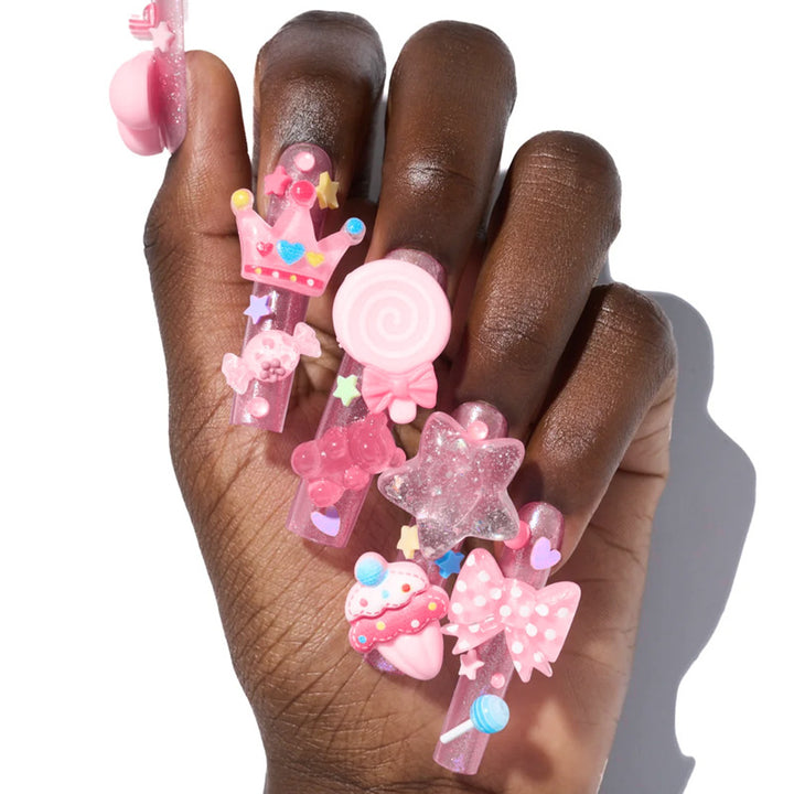 Creative nail art set with playful designs and glitter accents Bowlift
