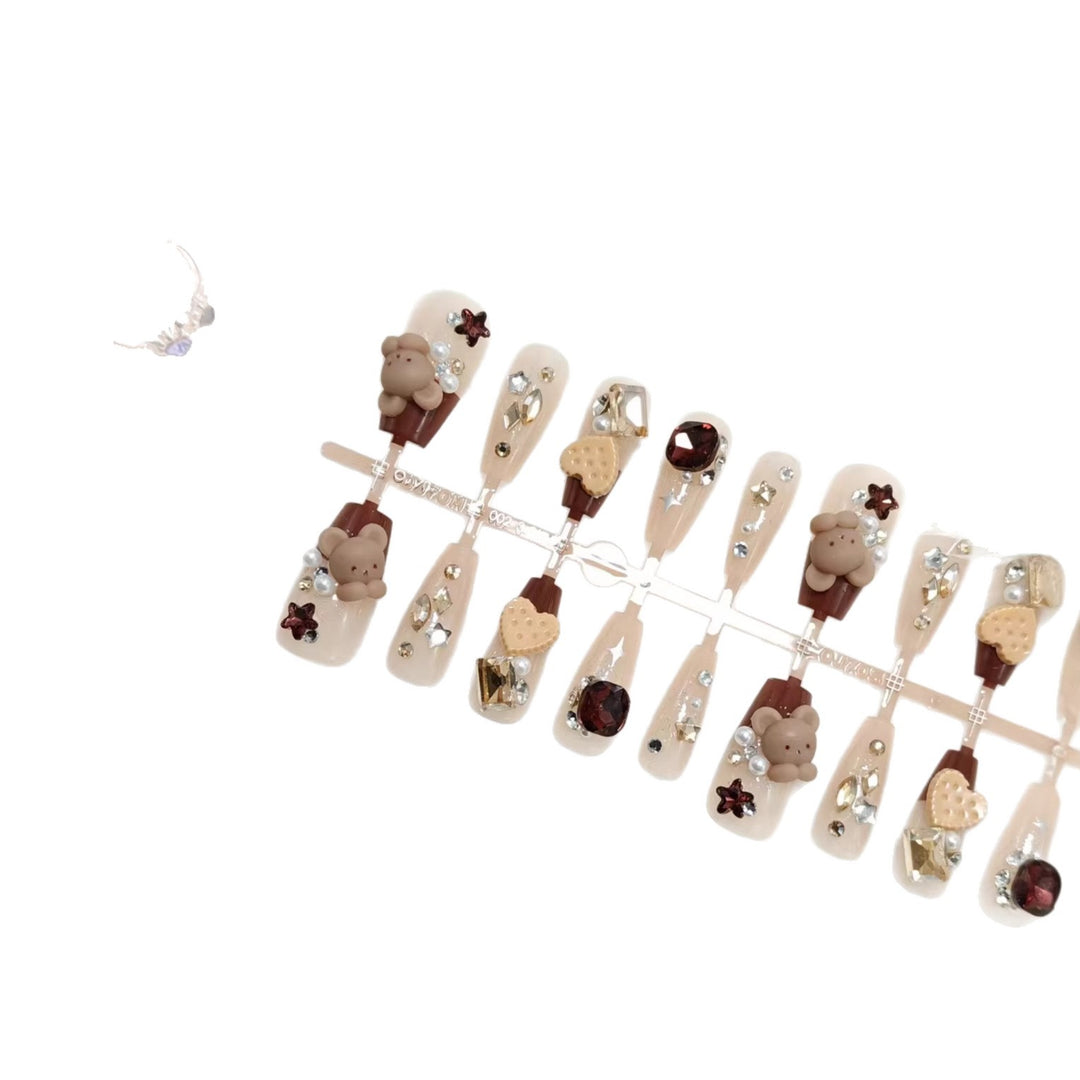 Creative acrylic nails with animal motifs and glitter accents Bowlift