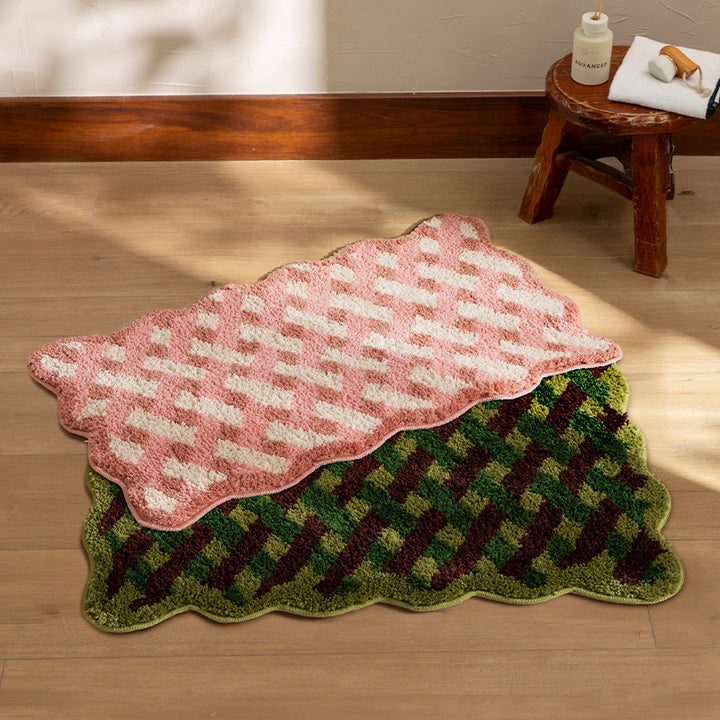 Tufted bathroom runner with wavy hem and relief-style braided pattern Bowlift