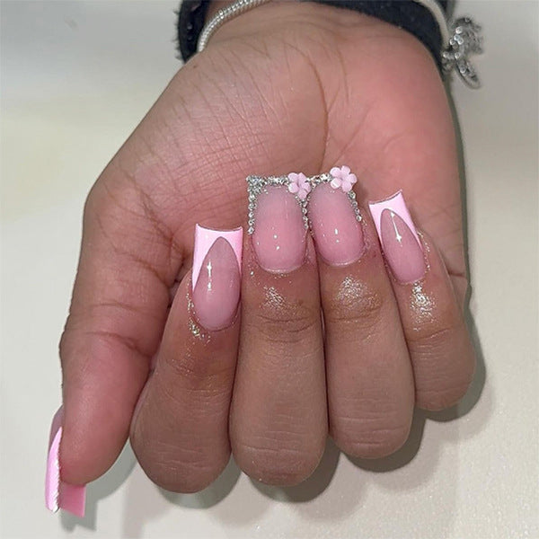 Artful gel nails with elegant floral design and glitter accents Bowlift