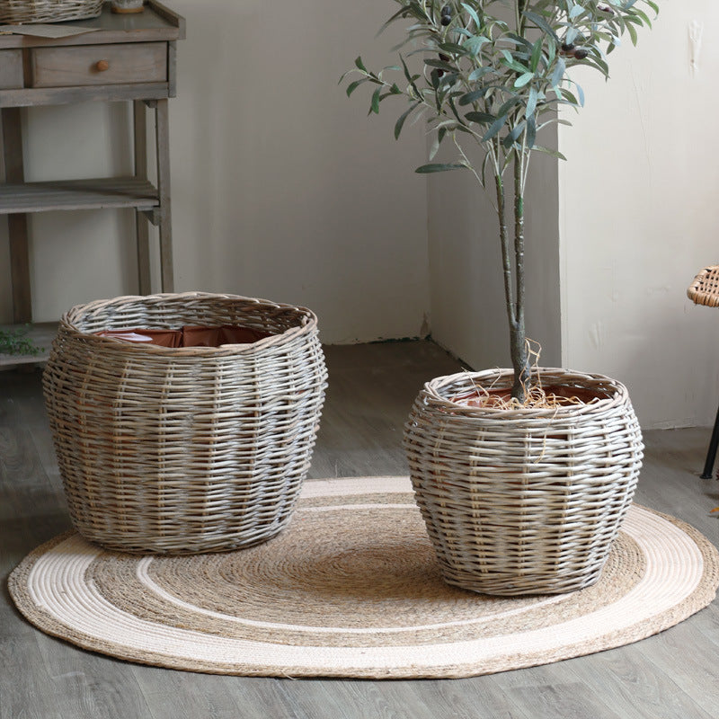 Stylish laundry basket made of braided natural material Bowlift