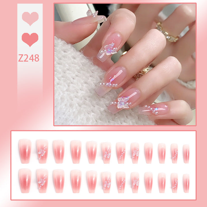 Artificial nails with luxurious pearl and glitter decorations Bowlift