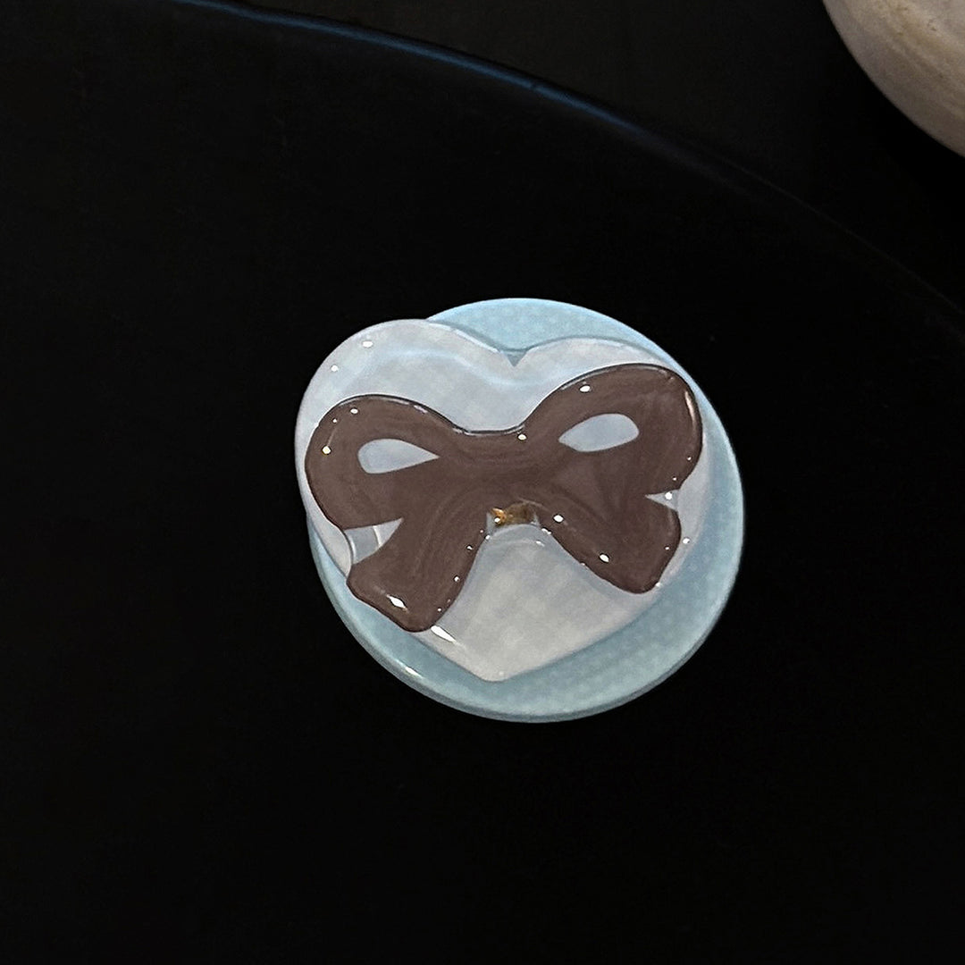 Decorative ceramic coaster with bow motif Bowlift