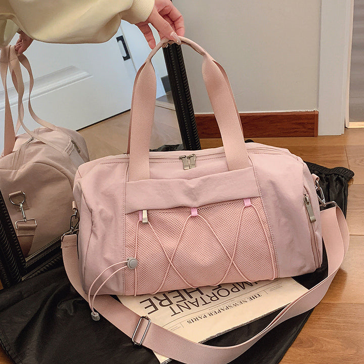 Sporty shoulder bag with adjustable carrying handles and breathable mesh material Bowlift