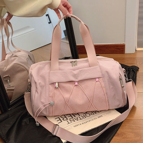 Sporty shoulder bag with adjustable carrying handles and breathable mesh material Bowlift