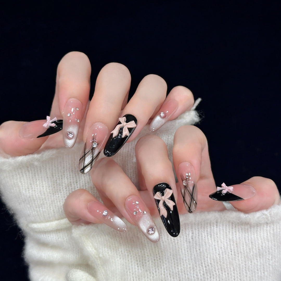 Artificial nail tips with elegant bows and glitter details Bowlift