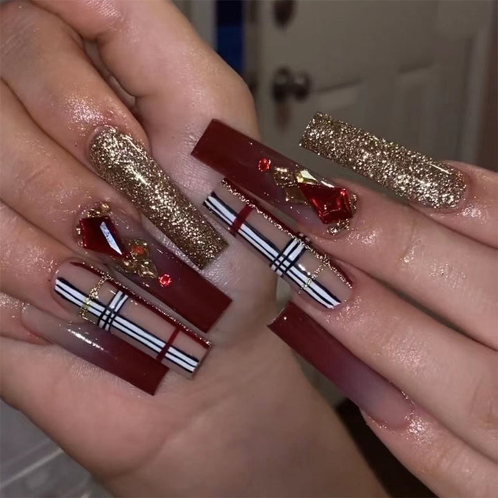 Glamorous stiletto nails with extravagant design and glitter accents Bowlift