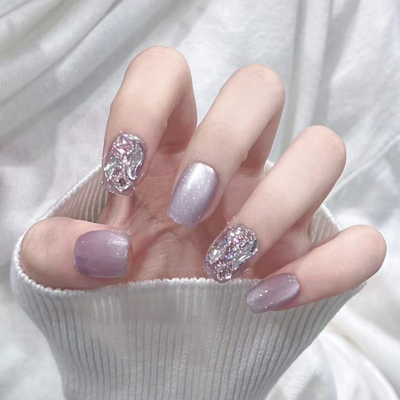 Artificial nail set with glitter and metallic effects Bowlift