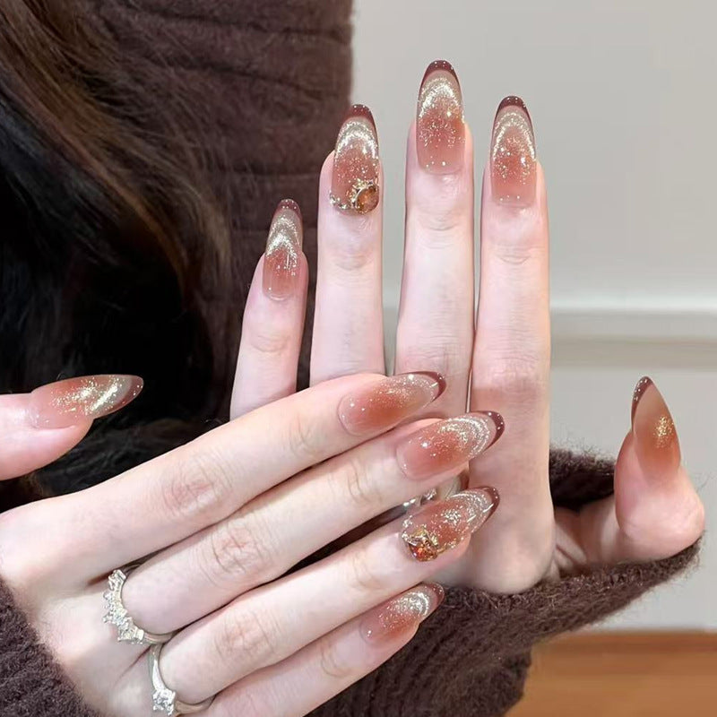 Glamorous artificial nails with creative embellishments Bowlift