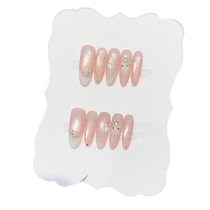 Artificial nail tips with playful penguin and paw print design Bowlift