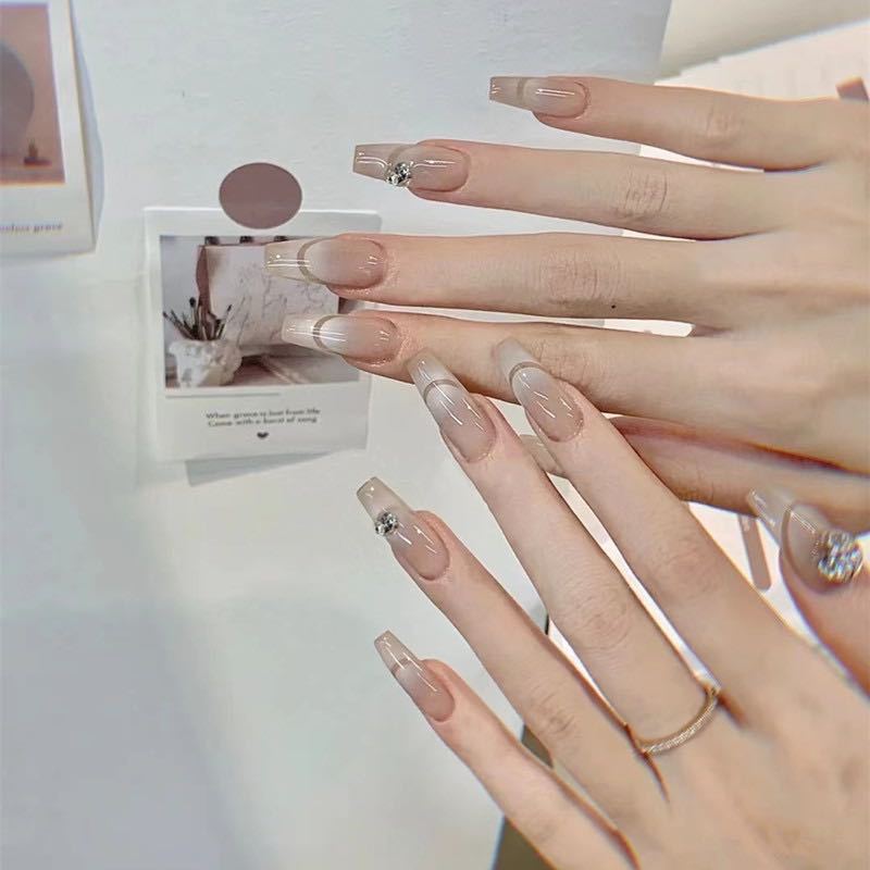 Glamorous artificial nails with elegant rhinestone decorations Bowlift