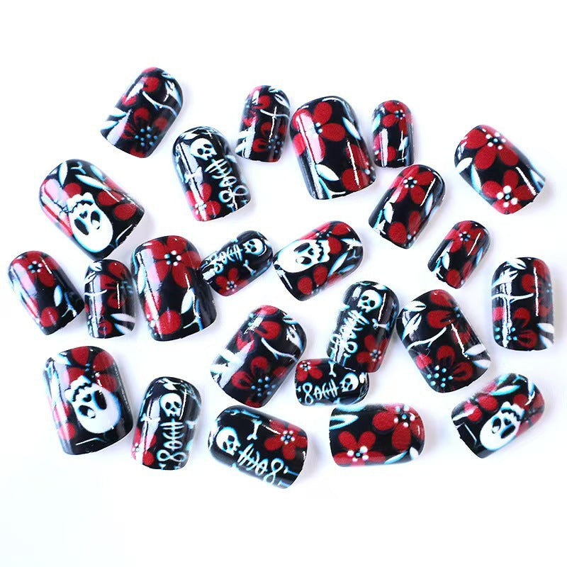 Artificial nail set with creepy skull design and floral accents Bowlift