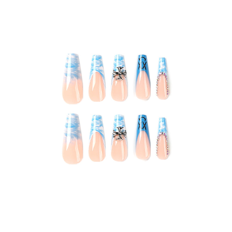 Artistic acrylic nails with marbled design and unique embellishments Bowlift